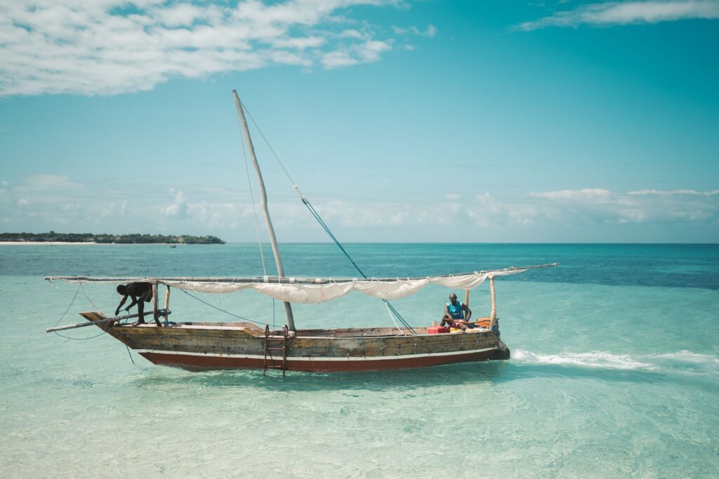 Fishermen sailing a traditional dhow off Zanzibar