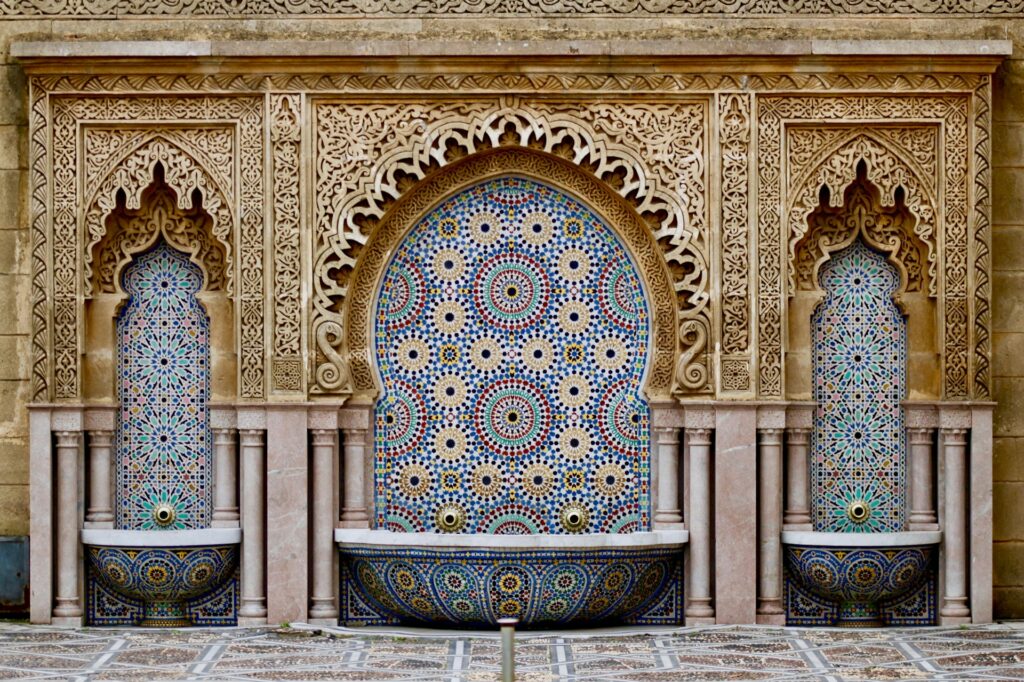 Hand-laid zellige tilework in a Moroccan fountain