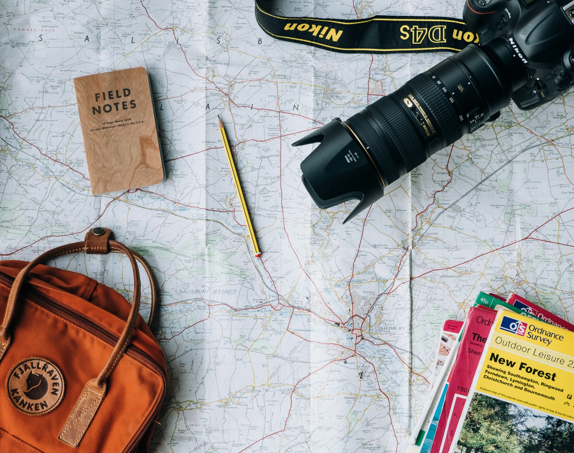 Map, camera and travel notes laid out for planning